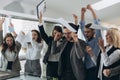 Group of business people celebrating by throwing their business papers and documents fly in air, Power of cooperation, Success Royalty Free Stock Photo