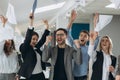 Group of business people celebrating by throwing their business papers and documents fly in air, Power of cooperation, Success Royalty Free Stock Photo