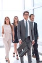 business people confidently walking in a modern office building Royalty Free Stock Photo