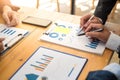 Group of business people discussing with analyzing data financial report at the office desk on monthly meeting. Accounting concept