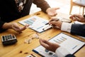 Group of business people discussing with analyzing data financial report at the office desk on monthly meeting. Accounting concept