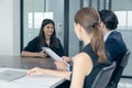 Group of business people discussing the charts and graphs showing the results of their successful teamwork, Royalty Free Stock Photo