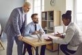 Group of business people discussing corporate project in office Royalty Free Stock Photo