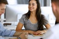 Group of business people discussing questions at meeting. Headshot of casual dressed businesswoman happy smiling to her Royalty Free Stock Photo