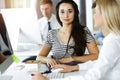 Group of business people discussing questions at meeting. Portrait of casual dressed businesswoman happy smiling to her Royalty Free Stock Photo