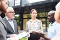 Group of Business People Discussing Work Outdoors Royalty Free Stock Photo