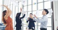 Group of business people finish job done throwing paper work and dance with happiness. Diversity people dance, fun, joy, happy Royalty Free Stock Photo