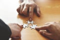 Group of Business people hands are holding jigsaw puzzle. Royalty Free Stock Photo