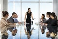 Group Of Business People Having Board Meeting Around Glass Table Royalty Free Stock Photo