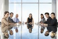 Group Of Business People Having Board Meeting Around Glass Table Royalty Free Stock Photo