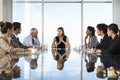 Group Of Business People Having Board Meeting Around Glass Table Royalty Free Stock Photo