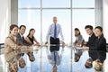 Group Of Business People Having Board Meeting Around Glass Table Royalty Free Stock Photo