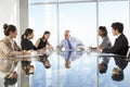 Group Of Business People Having Board Meeting Around Glass Table Royalty Free Stock Photo