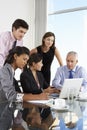 Group Of Business People Having Meeting Around Laptop At Glass T Royalty Free Stock Photo