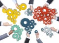 Group of Business People Holding Gears Royalty Free Stock Photo