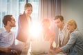 Group of business people interacting using laptop Royalty Free Stock Photo