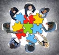 Group of Business People with Jigsaw Photo Illustration