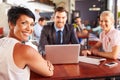 Group of business people with laptop meeting in coffee shop Royalty Free Stock Photo