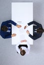 Group of business people and lawyer discussing contract papers sitting at the table, view from above. Businessman is
