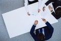 Group of business people and lawyer discussing contract papers sitting at the table, view from above. Businessman is