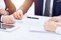 Group of business people and lawyers discussing contract papers sitting at the table, close-up. Successful teamwork Royalty Free Stock Photo