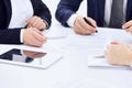 Group of business people and lawyers discussing contract papers sitting at the table, close-up. Successful teamwork Royalty Free Stock Photo