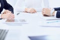 Group of business people and lawyers discussing contract papers sitting at the table, close-up. Successful teamwork Royalty Free Stock Photo