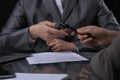 Group of business people and lawyers discussing contract sitting at the table. Woman chief is taking pen for signing Royalty Free Stock Photo