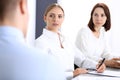 Group of business people or lawyers discussing terms of transaction in office. Colleagues working all together. Focus a Royalty Free Stock Photo