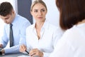 Group of business people or lawyers discussing terms of transaction in office. Meeting and teamwork concept Royalty Free Stock Photo