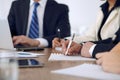 Group of business people or lawyers at meeting, hands close-up