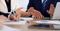 Group of business people or lawyers at meeting, hands close-up