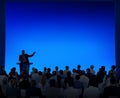 Group Of Business People Listening To A Speech