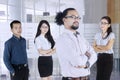 Business people stands with folded arms in office Royalty Free Stock Photo