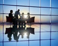 Group of Business People Meeting in Back Lit Royalty Free Stock Photo