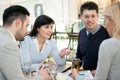 Group of business people meeting in coffee shop and holding a b Royalty Free Stock Photo