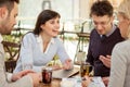 Group of business people meeting in coffee shop and holding a b Royalty Free Stock Photo