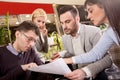 Group of business people meeting in coffee shop and holding a b Royalty Free Stock Photo