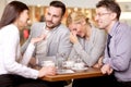 Group of business people meeting in coffee shop and holding a b Royalty Free Stock Photo