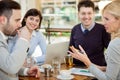 Group of business people meeting in coffee shop and holding a b Royalty Free Stock Photo