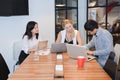 Group of business people meeting in a meeting room, sharing their ideas Royalty Free Stock Photo