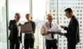 Group of business People Meeting  in office on window . marketing team Conference Brainstorming. manager man standing and present Royalty Free Stock Photo