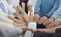 Diverse team of business people join their hands to show concept of teamwork, union, and support Royalty Free Stock Photo