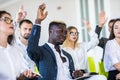 Group of business people raise hands up to agree with speaker in the meeting room seminar. Business concept Royalty Free Stock Photo