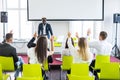 Group of business people raise hands up to agree with speaker in the meeting room seminar. Business meeting Royalty Free Stock Photo
