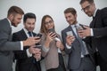 Group of business people reading a message on phones Royalty Free Stock Photo