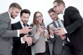 Group of business people reading a message on phones Royalty Free Stock Photo