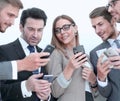 Group of business people reading a message on phones Royalty Free Stock Photo