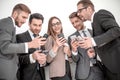 group of business people reading a message on phones Royalty Free Stock Photo