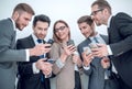 Group of business people reading a message on phones Royalty Free Stock Photo